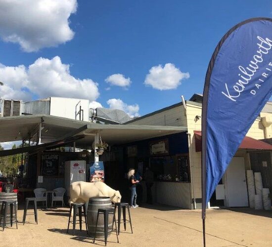 The outside of a restaurant on the Sunshine Coast with a blue and white flag.