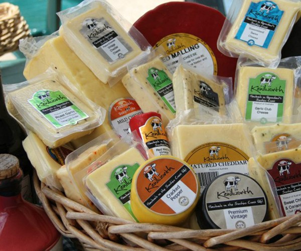 A wicker basket filled with a variety of cheeses perfect for a Maleny wine tour or Sunshine Coast sightseeing.
